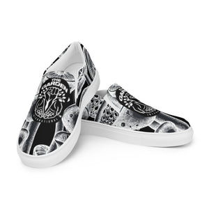 Black and White Slide-On Canvas Shoes with The Garden International Logo – Eco-Friendly, Comfortable Footwear for Mycology Enthusiasts and Sustainable Fashion.